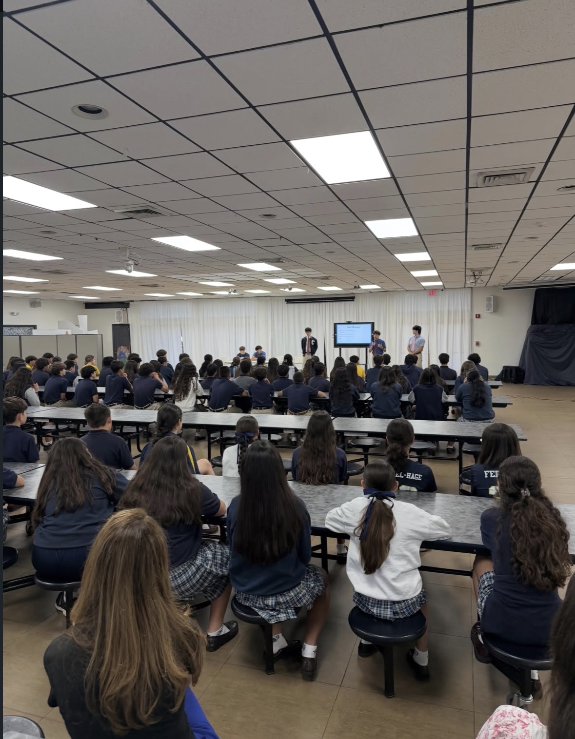B.O.L.D. presenters speaking to students during a school presentation
